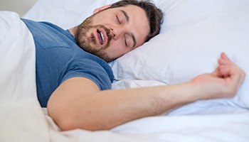 Man sleeping with his mouth open