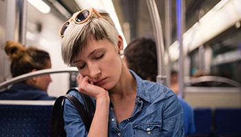 Woman asleep on the train