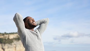 Man standing outside, enjoying good health