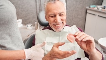 Dentures patient in Danville listening to dentist