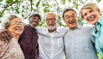 Dentures patient in Danville smiling with friends